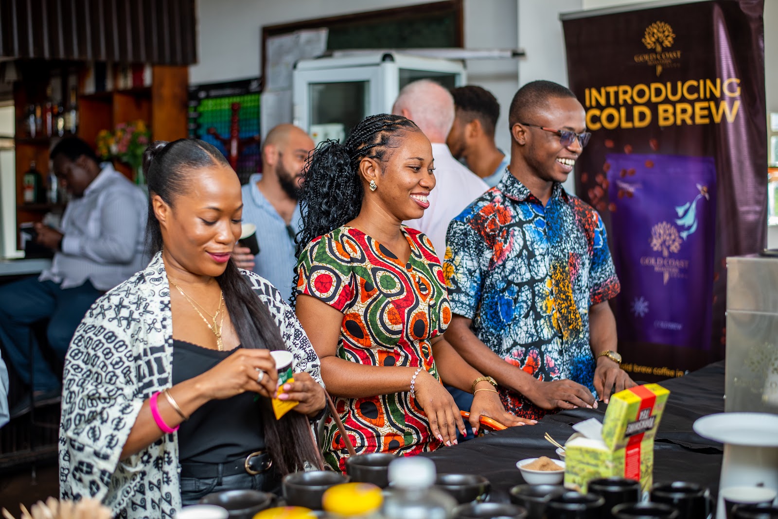 Friends of Ireland Ghana members talking together at a community gathering.