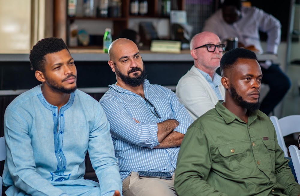 Younger attendees listening at a Friends of Ireland Ghana event.