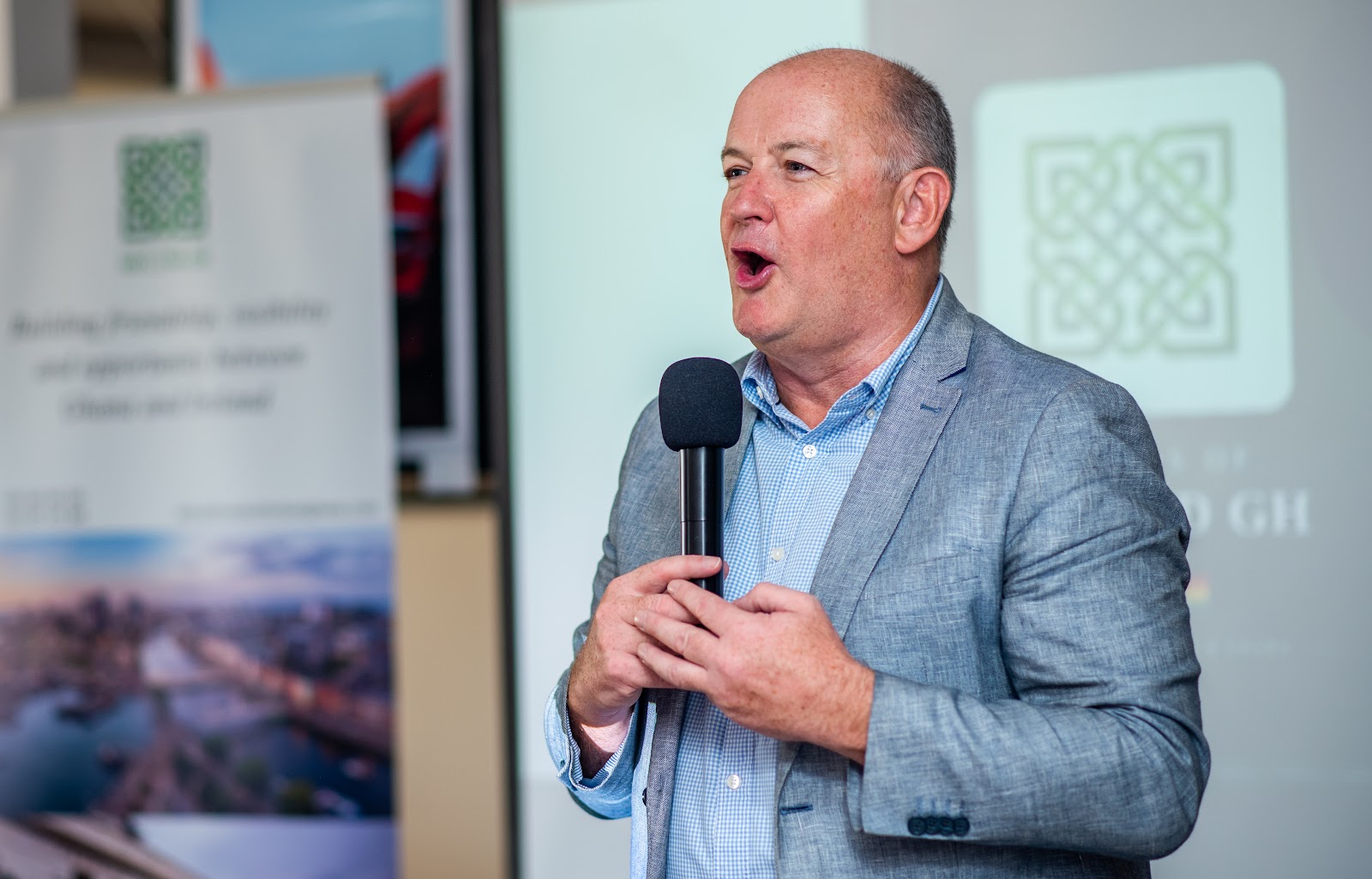 A speaker addressing guests at a Friends of Ireland Ghana breakfast briefing.