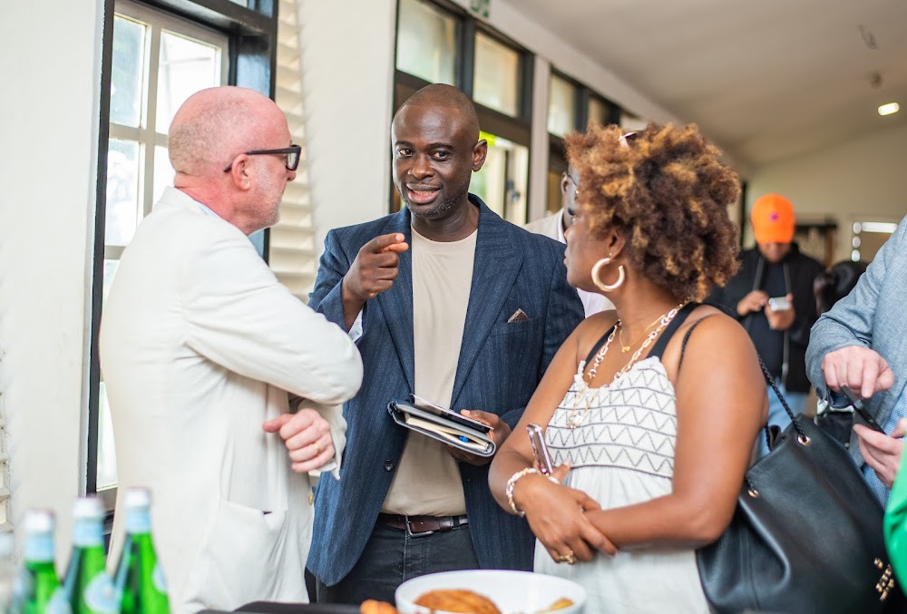 Irish and Ghanaian guests in conversation at a Friends of Ireland Ghana event.
